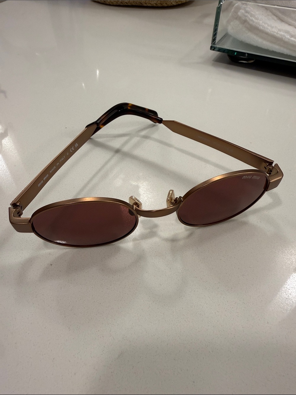 Miu Miu Metallic Rose Gold Oval Sunglasses with Brown Lenses
